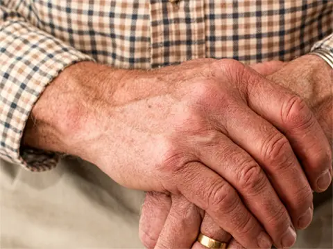 older man's hands that are crossed - Man, Revised by David B. Prather