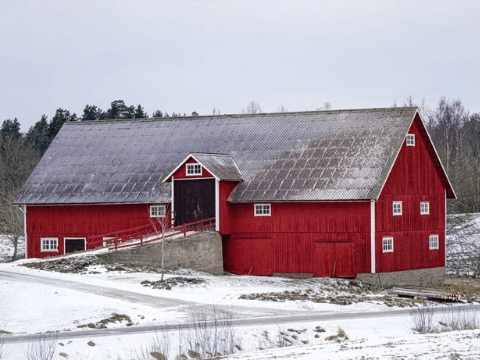 Red barn on a snowy field