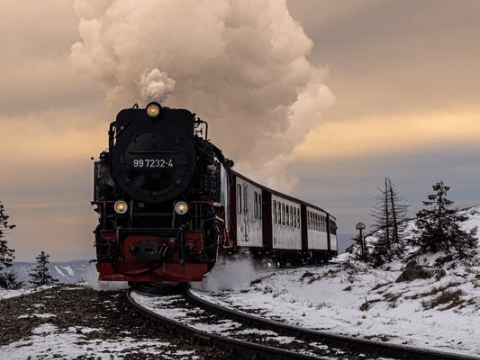 Steam train on a snowy track