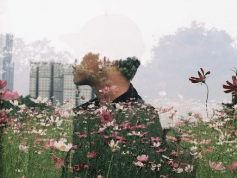 Double exposure of man with flowers